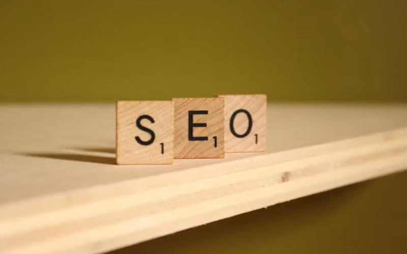 Wooden scrabble tiles spelling out SEO on a wooden desk